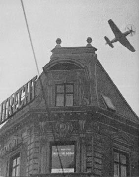 Mustang fighter flying low over Copenhagen during the attack